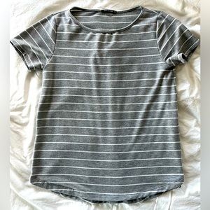 Pink clover, gray, jersey like material. Size small.